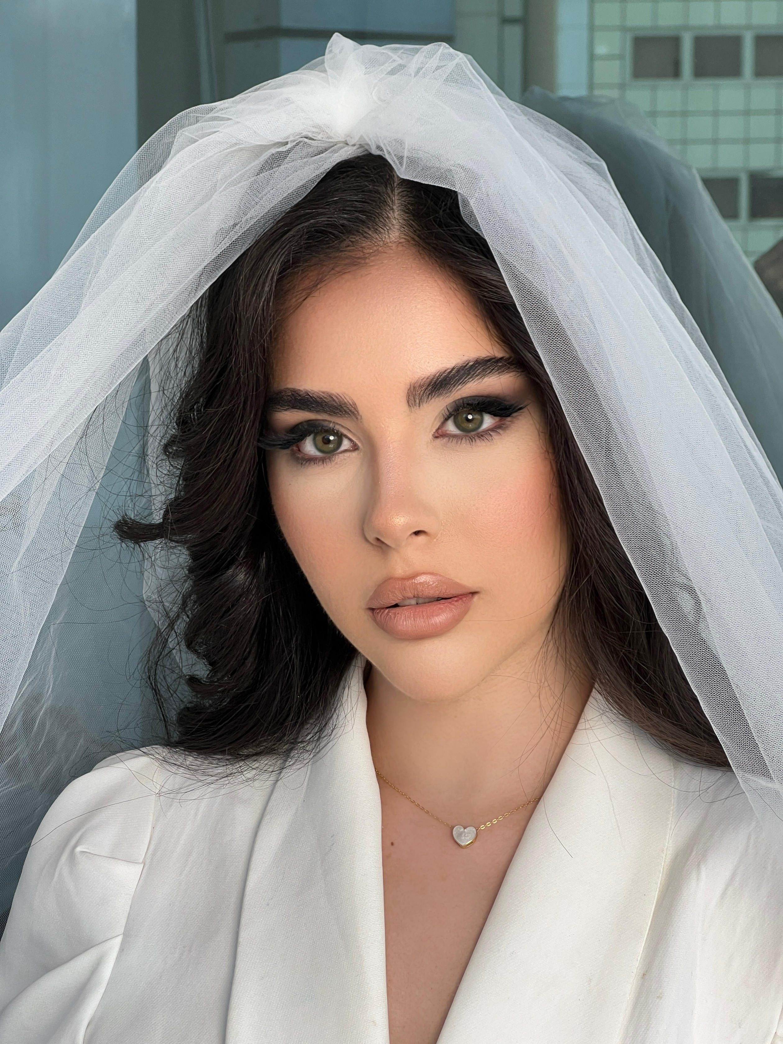 Sahar of Makeup By Sahar — London bridal MUA applying soft glam wedding makeup on the wedding morning